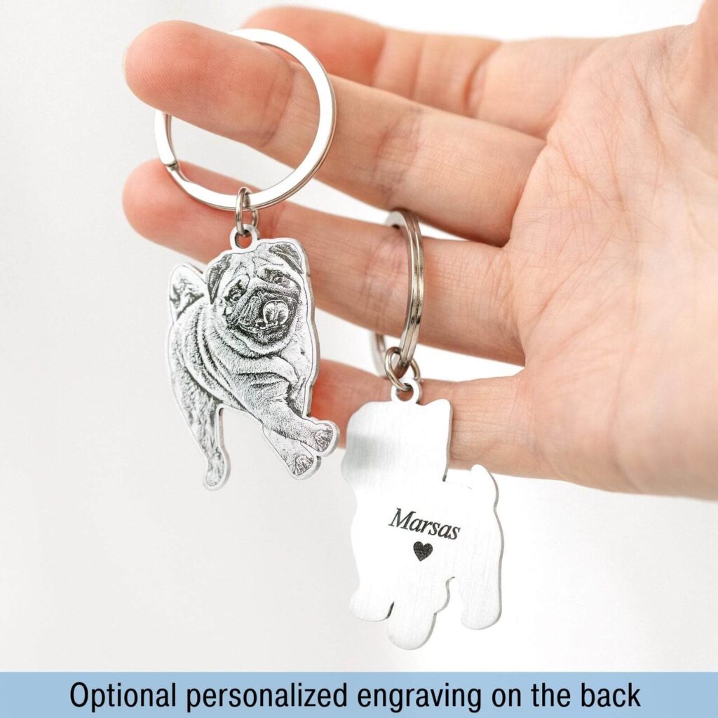 Personalized custom engraving on the back of silver pet ID tag showing name and date