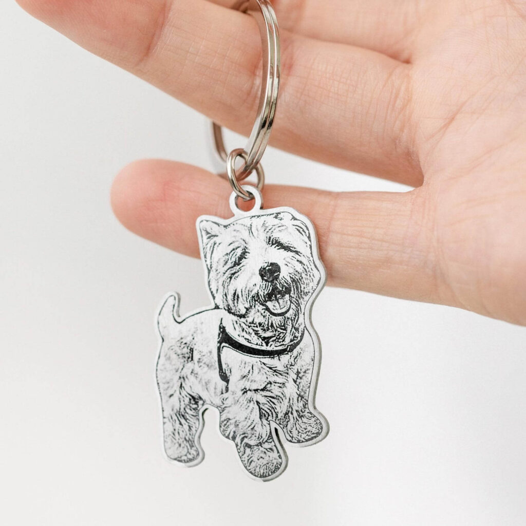 Detailed hand-held silver Westie dog portrait engraved pet ID tag