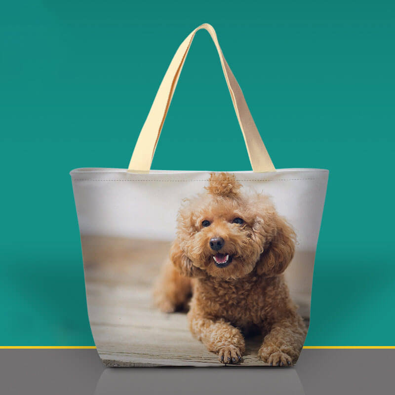 Personalized pet photo tote bag with a happy brown poodle.