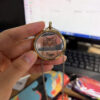 Openable pet portrait necklace featuring a custom cat illustration and name