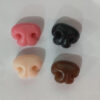 Close up of colorful 3D Q-elastic silicone noses for custom pet portrait magnets