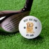 Custom dog photo golf ball displayed next to a golf club for pet lovers