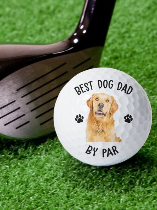 Custom dog photo golf ball displayed next to a golf club for pet lovers