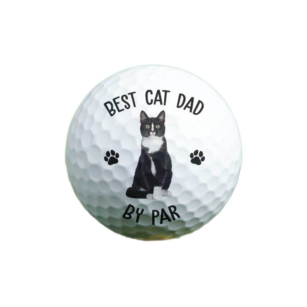 Custom pet portrait golf ball with black and white cat image on white background