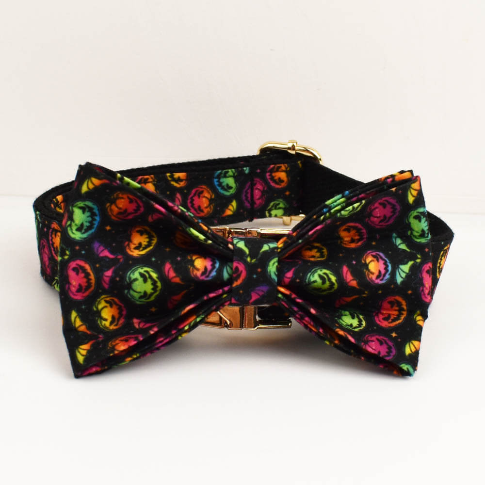 Close-up of vibrant colorful pumpkin pattern dog collar featuring a detachable bow