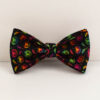 Close-up of the vibrant colorful pumpkin patterned dog bow tie