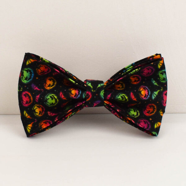 Close-up of the vibrant colorful pumpkin patterned dog bow tie