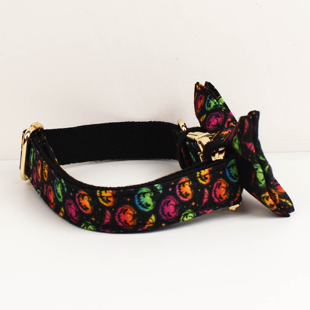 Side angle view of the colorful pumpkin Halloween dog collar and bow